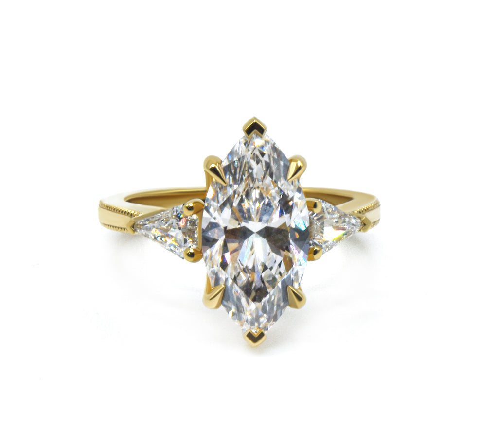 Marquise cut Three Stone Engagement Ring