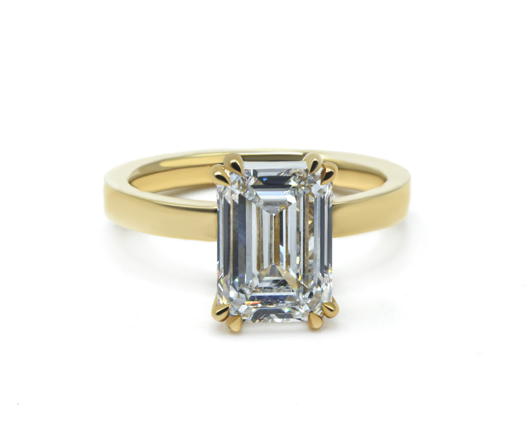 Emerald Cut Solitaire Ring with a Flat Band