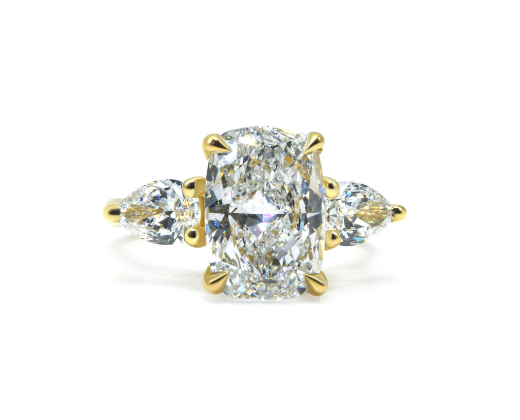 Elegant Three-Stone Cushion and Pear Lab-Grown Diamond Ring