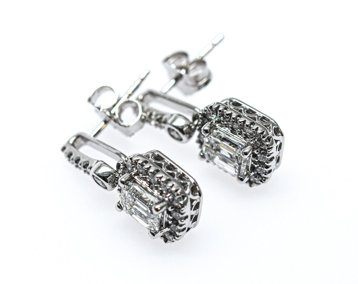 1.30 + carat Emerald Cut Lab Grown Diamond Earrings, set in the halo. Purediamond