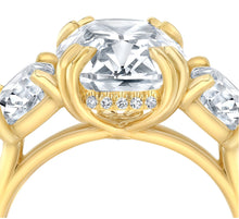 Three stone cushion cut diamond engagement ring