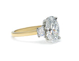 Two-Tone Oval Cut Diamond Three Stone Engagement Ring