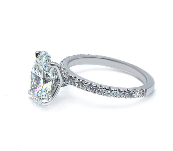 Sparkling Oval Cut Diamond Ring with Pave Band