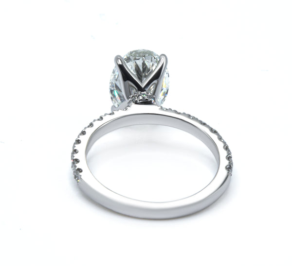 Sparkling Oval Cut Diamond Ring with Pave Band