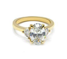 Timeless Elegance: Oval Cut Diamond Ring with Half Moon Side Stones