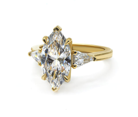 Marquise cut Three Stone Engagement Ring