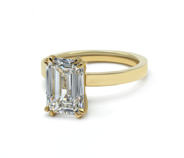 Emerald Cut Solitaire Ring with a Flat Band