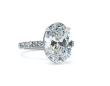 Two Tone Oval Brilliant cut Elegance Halo Ring
