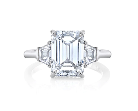 Three stone emerald cut diamond engagement ring