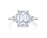 Three stone emerald cut diamond engagement ring