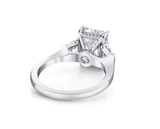 Three stone emerald cut diamond engagement ring