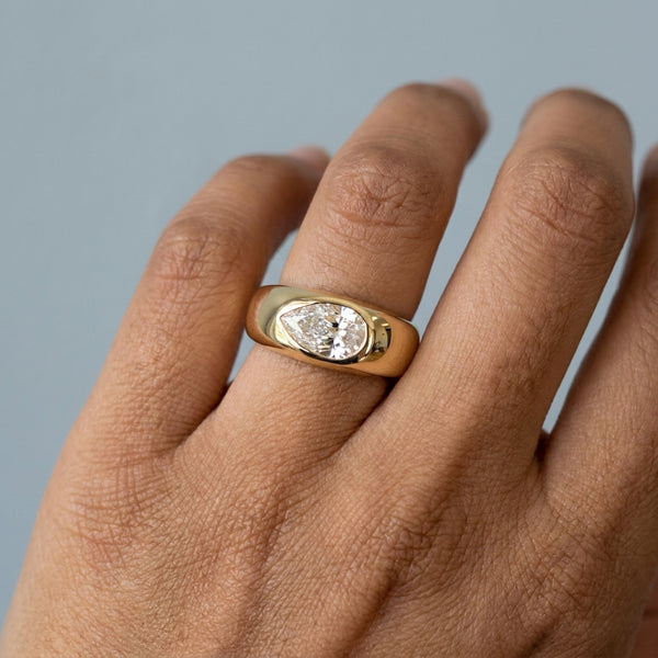 Hand model shot of the yellow gold engagement ring