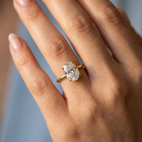 Hand model shot of the yellow gold engagement ring
