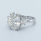 Two-Tone Oval Cut Diamond Three Stone Engagement Ring