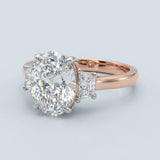 Two-Tone Oval Cut Diamond Three Stone Engagement Ring