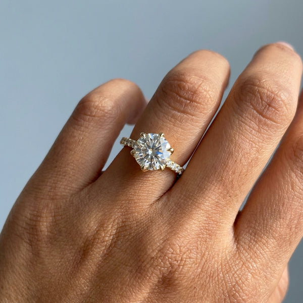 Hand model shot of the yellow gold engagement ring