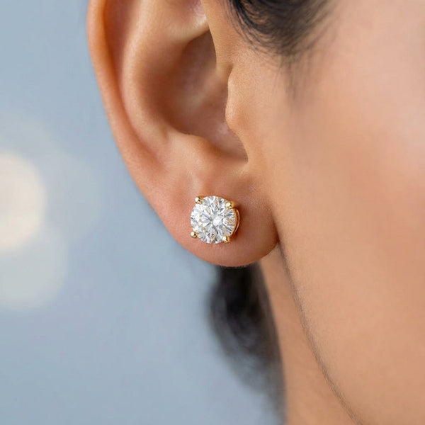 Model shot of the yellow gold earrings