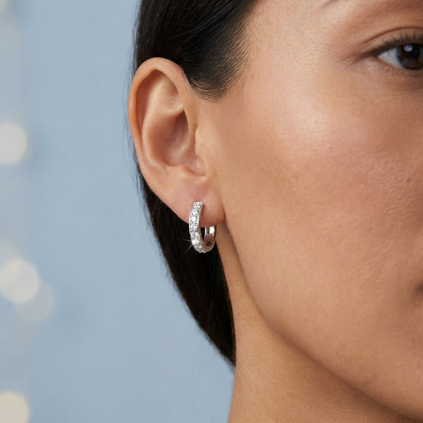 Model shot of the white gold earrings