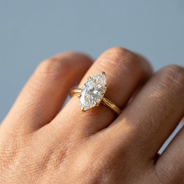 Hand model shot of the yellow gold engagement ring