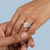 Two-Tone Oval Cut Diamond Three Stone Engagement Ring