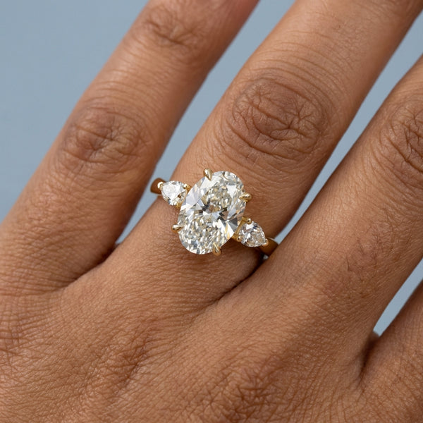 Hand model shot of the yellow gold engagement ring