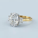 Two-Tone Oval Cut Diamond Three Stone Engagement Ring