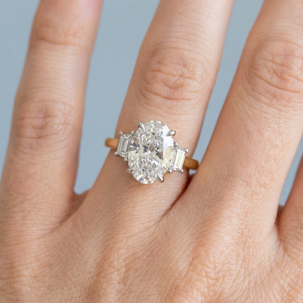 Hand model shot of the yellow gold engagement ring