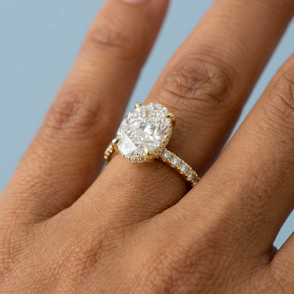 Hand model shot of the yellow gold engagement ring