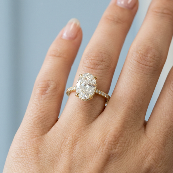 Hand model shot of the yellow gold engagement ring
