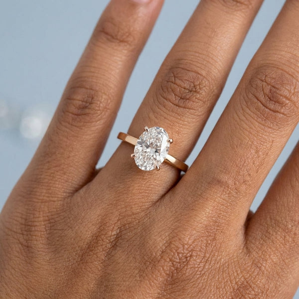 Hand model shot of the rose gold engagement ring