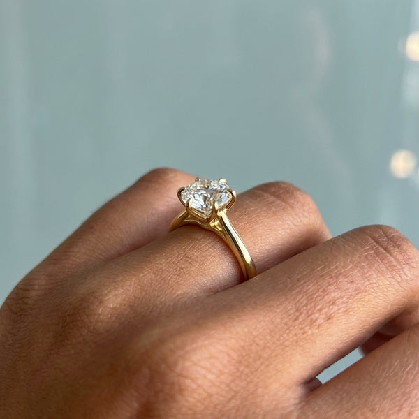 Hand model shot of the yellow gold engagement ring