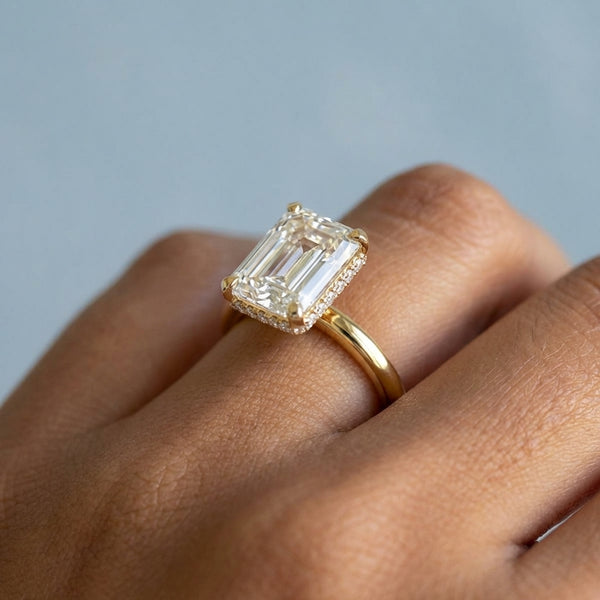 Hand model shot of the yellow gold engagement ring
