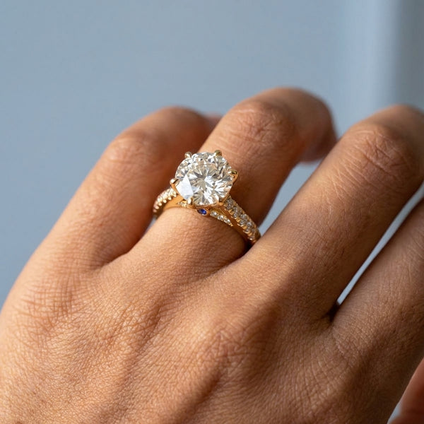 Hand model shot of the yellow gold engagement ring
