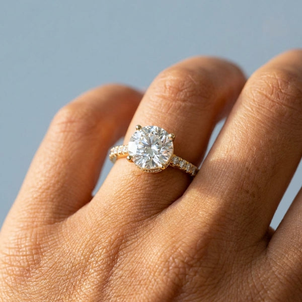Hand model shot of the yellow gold engagement ring