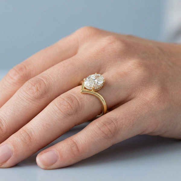 Hand model shot of the yellow gold engagement ring