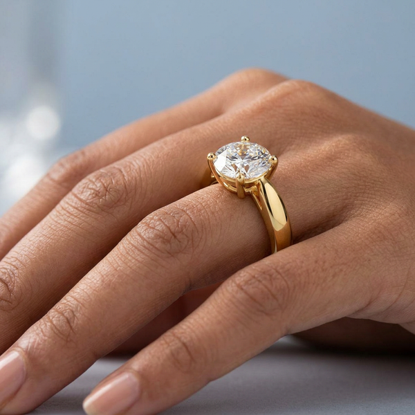 Hand model shot of the yellow gold engagement ring