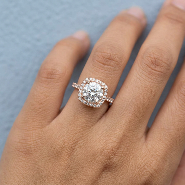 Hand model shot of the rose gold engagement ring