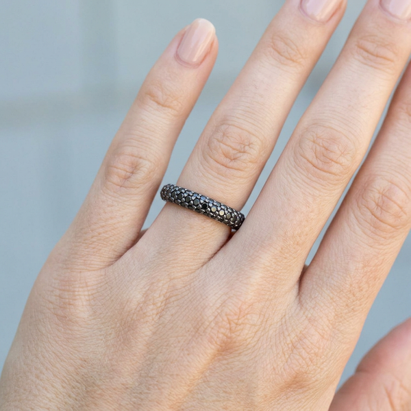 Hand model shot of the white gold Single French Cut Pave diamond wedding band