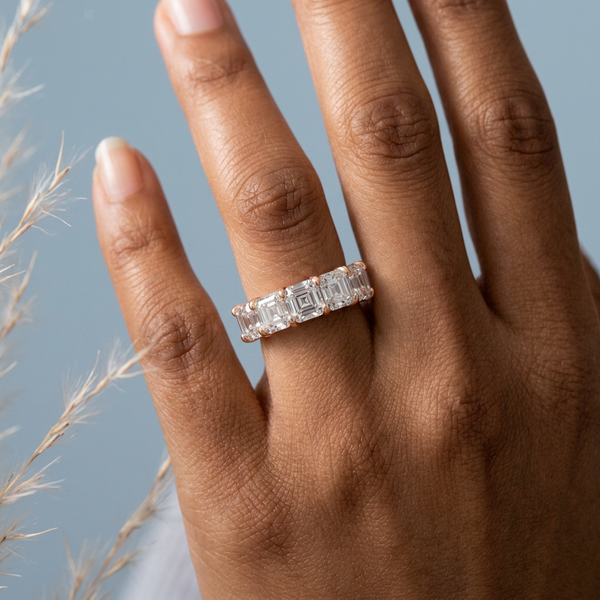 Hand model shot of the rose gold diamond wedding band