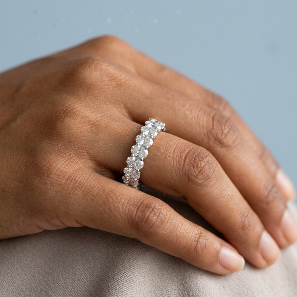 Hand model shot of the white gold Single French Cut Pave diamond wedding band