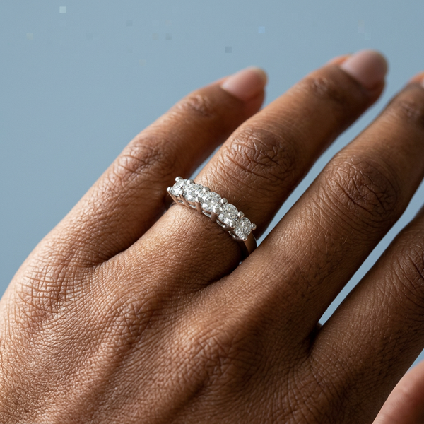 Hand model shot of the white gold diamond wedding band