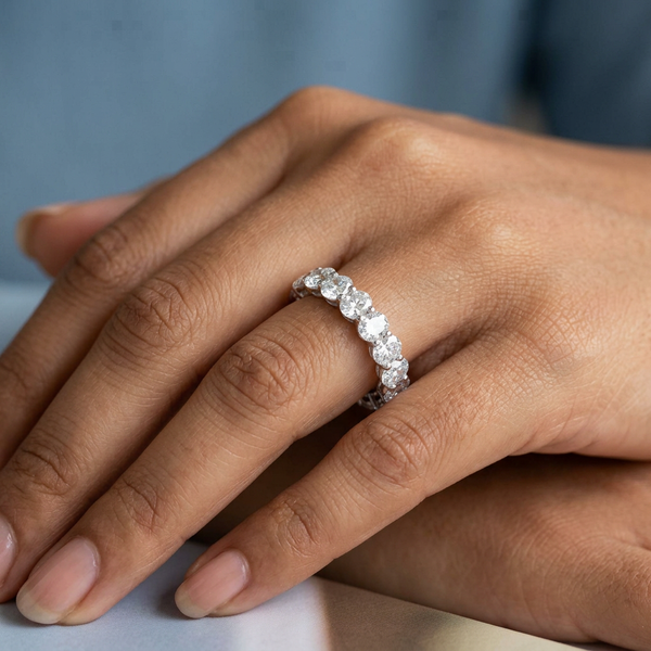 Hand model shot of the white gold Single French Cut Pave diamond wedding band
