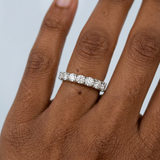 Round brilliant cut asymmetrical wedding band