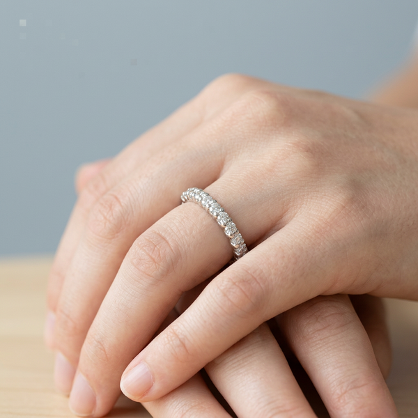 Hand model shot of the white gold diamond wedding band