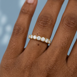 Round brilliant cut asymmetrical wedding band