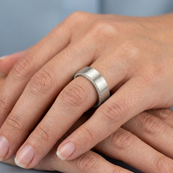 Hand model shot of the white gold diamond wedding band
