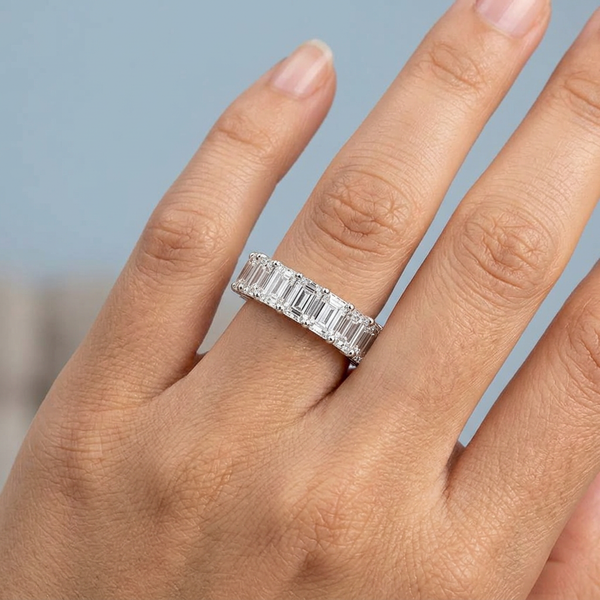 Hand model shot of the white gold Single French Cut Pave diamond wedding band