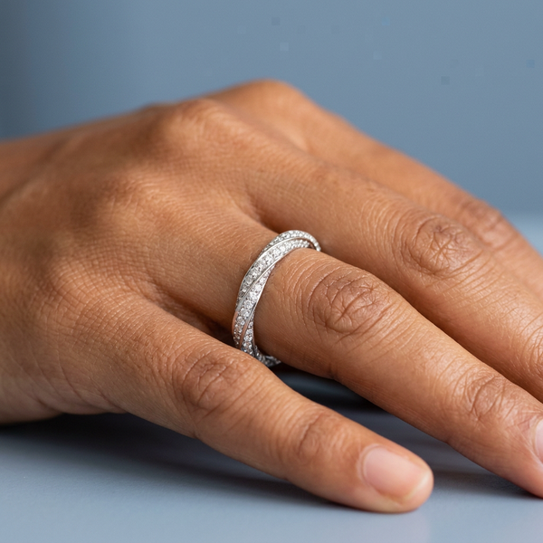 Hand model shot of the white gold Single French Cut Pave diamond wedding band