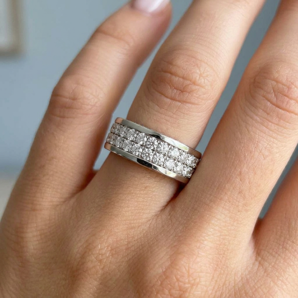 Hand model shot of the white gold Single French Cut Pave diamond wedding band