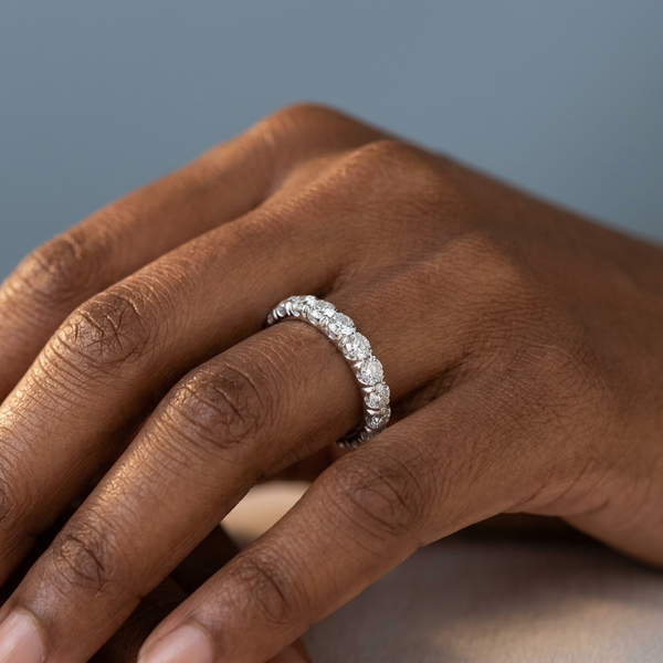 Hand model shot of the white gold Single French Cut Pave diamond wedding band
